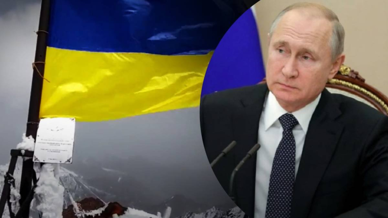 Mountain "Putin Peak" ; decorated with a blue and yellow flag